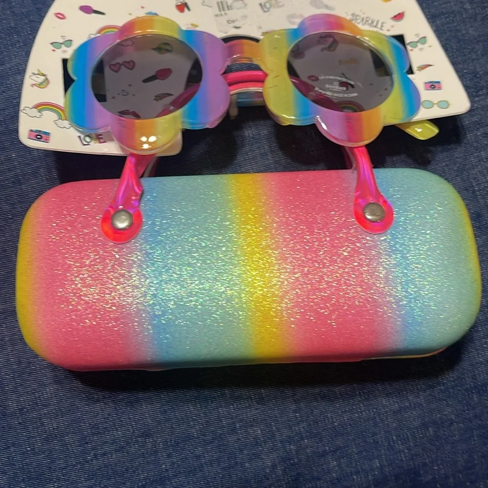 Sunglasses and case. Little girl. Few scratches on the frame. See pictures
